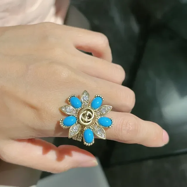 Bagues inspirées de Gucci Marmont avec nœud turquois et bagues avec interlocking G en doré 7