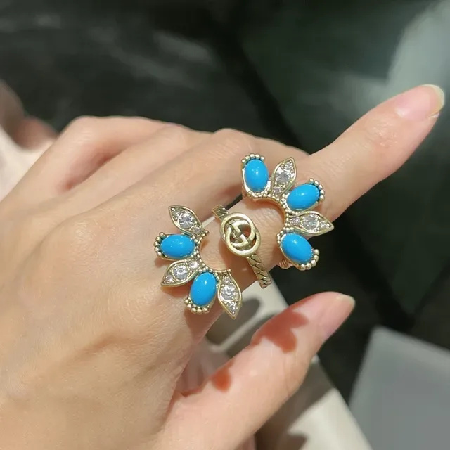 Bagues inspirées de Gucci Marmont avec nœud turquois et bagues avec interlocking G en doré 8