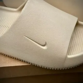 Nike Beige Molded One-Piece Embossed Swoosh Slippers