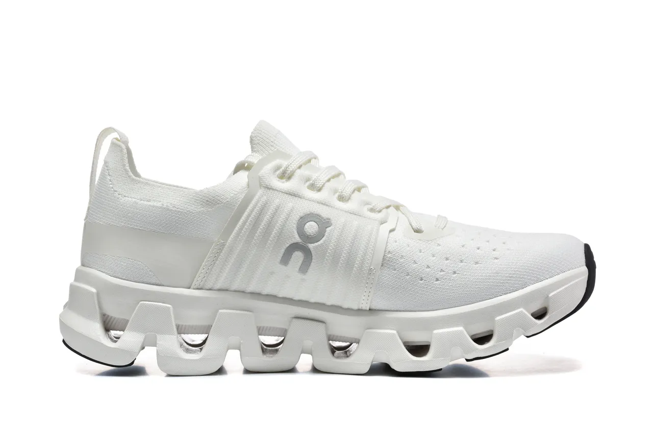 On Chaussures de course avec upper en tricot blanc noir, semelle intermédiaire segmentée CloudTec 4