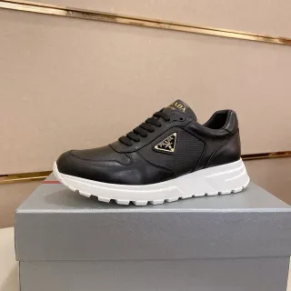 Prada Cloudbust Black White Leather And Perforated Upper Triangular Metal Logo Chunky Sneakers