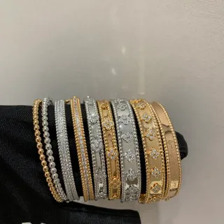 Van Cleef & Arpels Alhambra Pavé Gold and Silver Bangle Bracelets