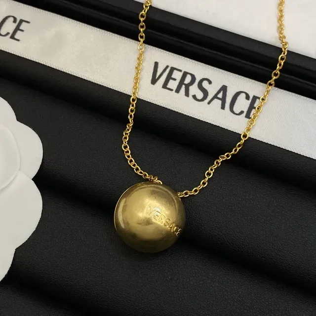 Versace Collier à pendentif sphérique doré 6