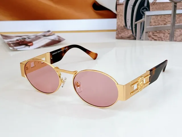 Versace Odissea Óculos de sol com lente ovalada dourada marrom e armação metálica 4