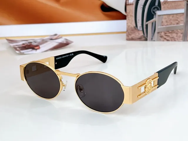 Versace Odissea Óculos de sol com lente ovalada dourada marrom e armação metálica 7