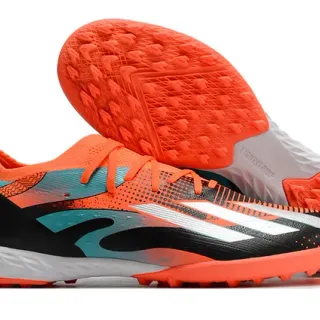 Adidas Chuteiras de futebol turf laranja e preto com upper de knit de corte baixo e sistema de amarração assimétrica