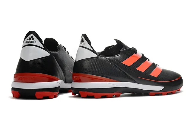 Adidas Zapatillas de fútbol para césped artificial de color naranja y negro con upper de sintético, cordones asimétricos y corte bajo 19