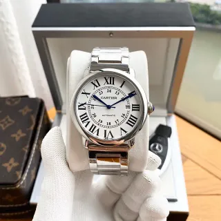 Cartier Ballon Bleu चाँदी सफेद गोल स्टेनलेस स्टील केस नीला तलवार आकार के हैंड्स मैकेनिकल घड़ी