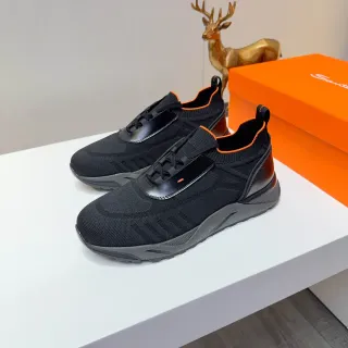 حذاء رياضي أسود وبرتقالي تريكو slip-on