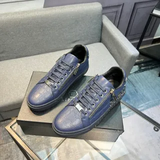 Zapatillas bajas de cuero azul con detalle de cremallera y estampado de cocodrilo