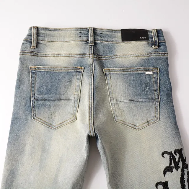 Distressed Light-Wash Graphic-Print Slim-Fit Jeans 16