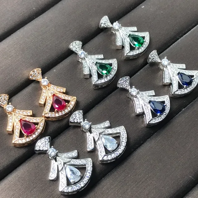 Colgante de joyería con motivo de lazo en tono dorado y plateado y gema en forma de lágrima 4