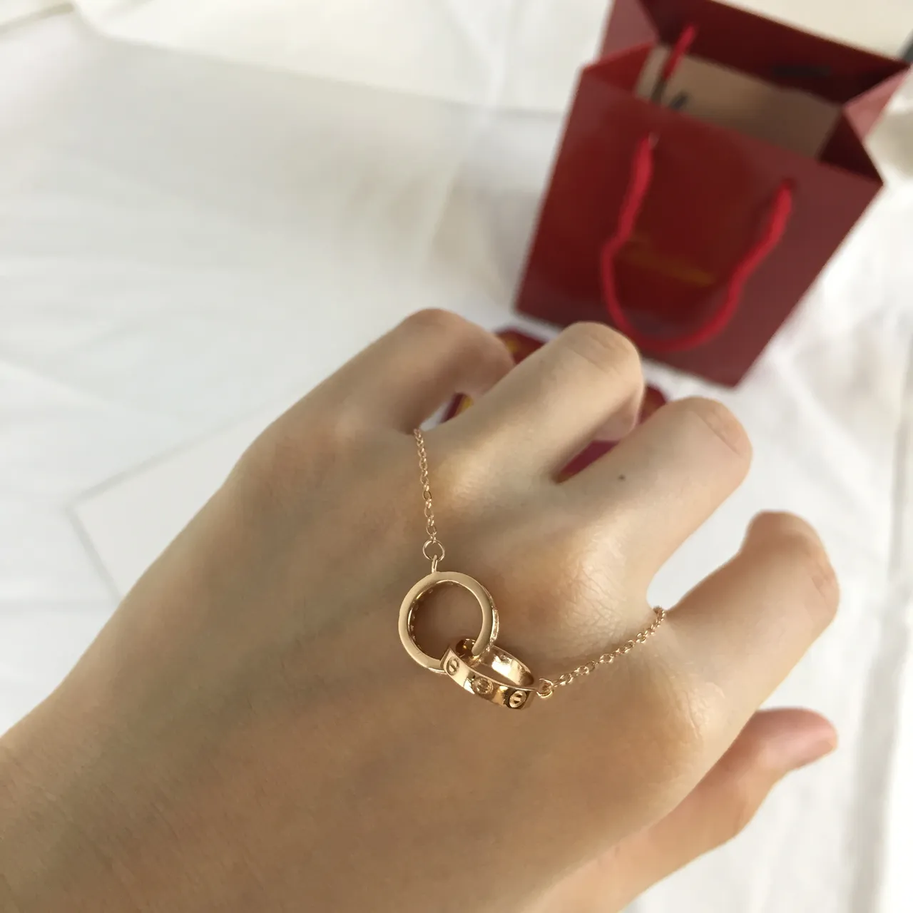 Gold-Tone Interlocking Double-Ring Pendant Necklace 4