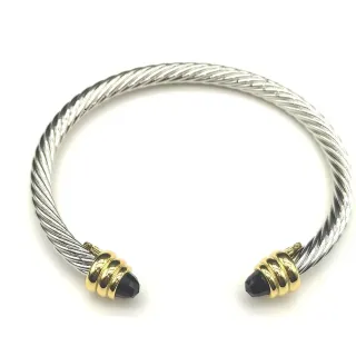 Pulsera de metal bicolor plateada y dorada con cable trenzado