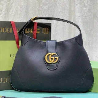 Gucci Sac en cuir noir doré texturisé Interlocking GG Hardware