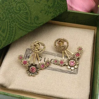 أقراط Gucci Flora ذهبي وردي معدنية مع زهور كريستال