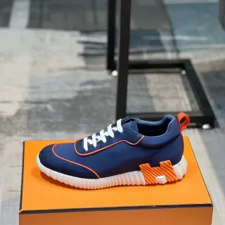 Hermès নেভি অরেঞ্জ নিওপ্রিন উপরের অংশের পাইপিং ডিটেল লাইফস্টাইল স্নিকার্স