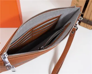 Hermès Bleu marine Cuir texturé grainé Logo H embossé wristlet 21