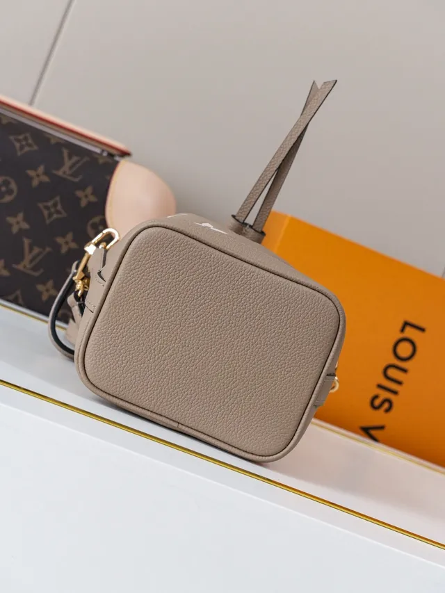 Louis Vuitton Sac seau beige blanc à cordon supérieur imprimé monogramme 6