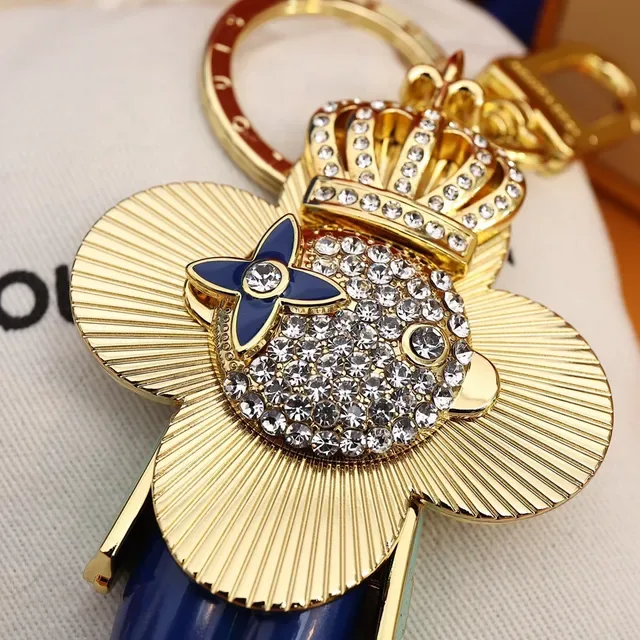 Louis Vuitton Broche avec Charm de Fleur Porte-clés en Or et Cristal Bleu 3