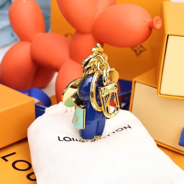Louis Vuitton Broche avec Charm de Fleur Porte-clés en Or et Cristal Bleu 4