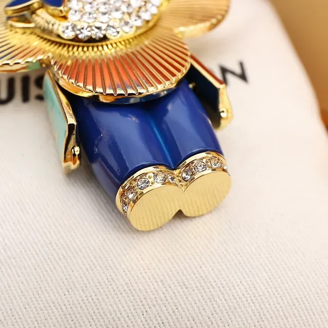 Louis Vuitton Broche avec Charm de Fleur Porte-clés en Or et Cristal Bleu 6