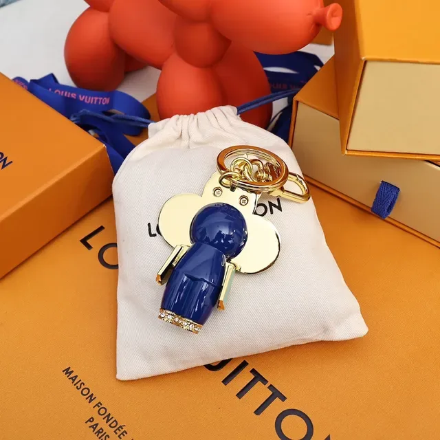 Louis Vuitton Broche avec Charm de Fleur Porte-clés en Or et Cristal Bleu 8