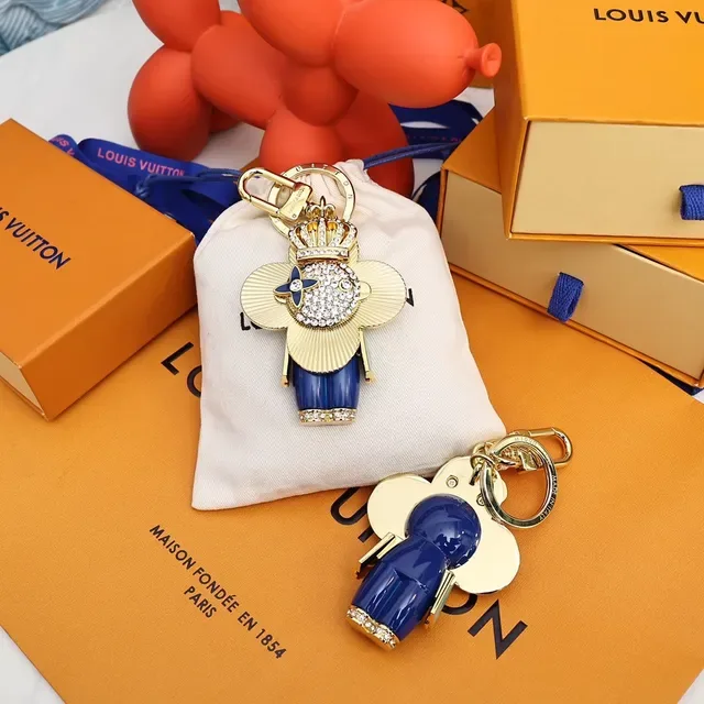Louis Vuitton Broche avec Charm de Fleur Porte-clés en Or et Cristal Bleu 9