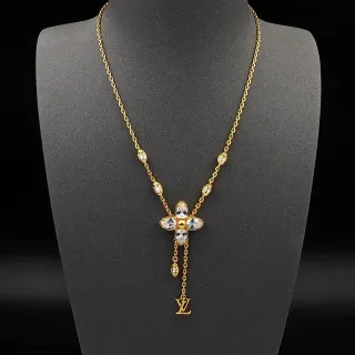 Collar Louis Vuitton Cadena Transparente Dorada con Péndulo Floral de Cristal