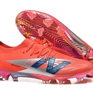 New Balance কমলা নীল লো-কাট সক-ফিট আপার অ্যাসিমেট্রিক লেসিং সিস্টেম ফার্ম-গ্রাউন্ড ফুটবল জুতো