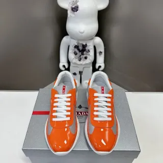 Prada Cloudbust Orange Gray Glossy Patent Leather Mesh Paneling Lifestyle Sneakers
